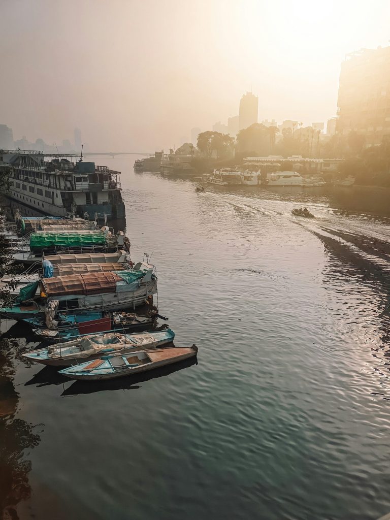 a group of boats floating on top of a river